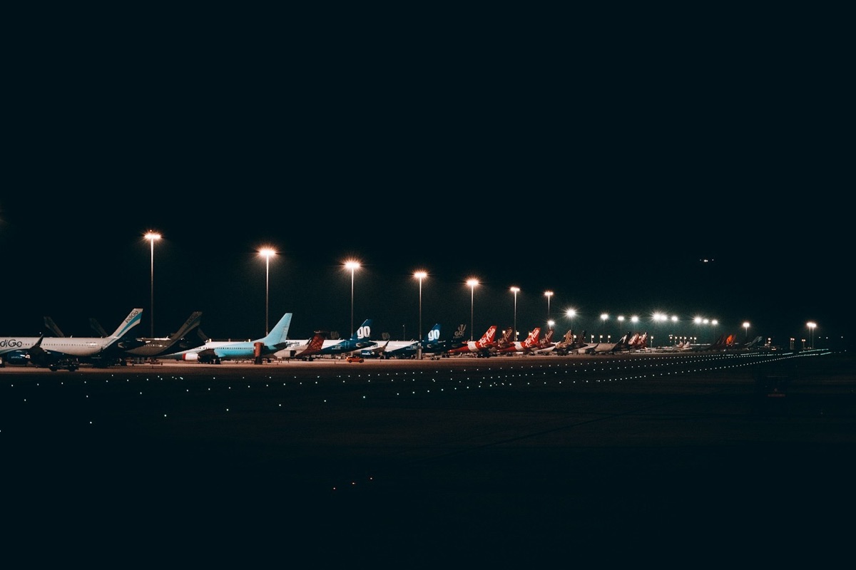 Aircraft on a floodlit apron at night