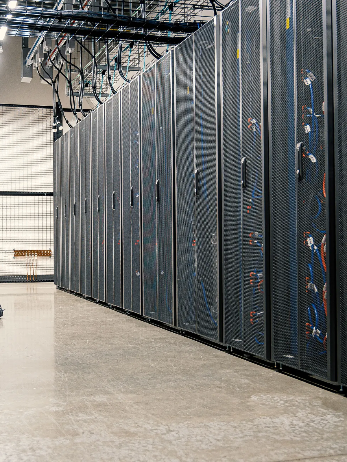 High-density server racks lining a secure data center corridor
